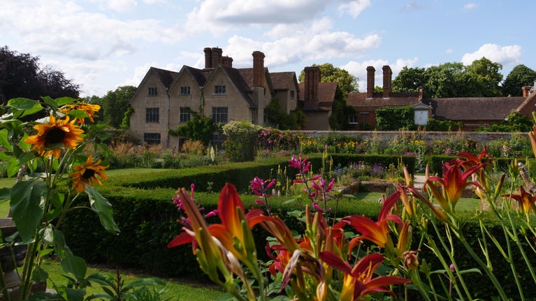 Packwood House, Warwickshire, seen across the summer gardens